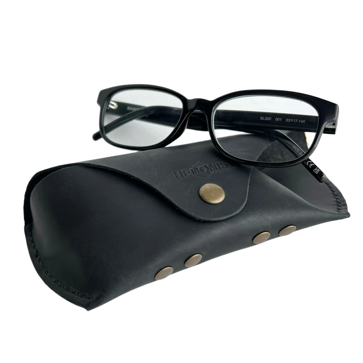 Soft Leather Eye Glasses Case in Black with black-framed eyeglasses resting on top
