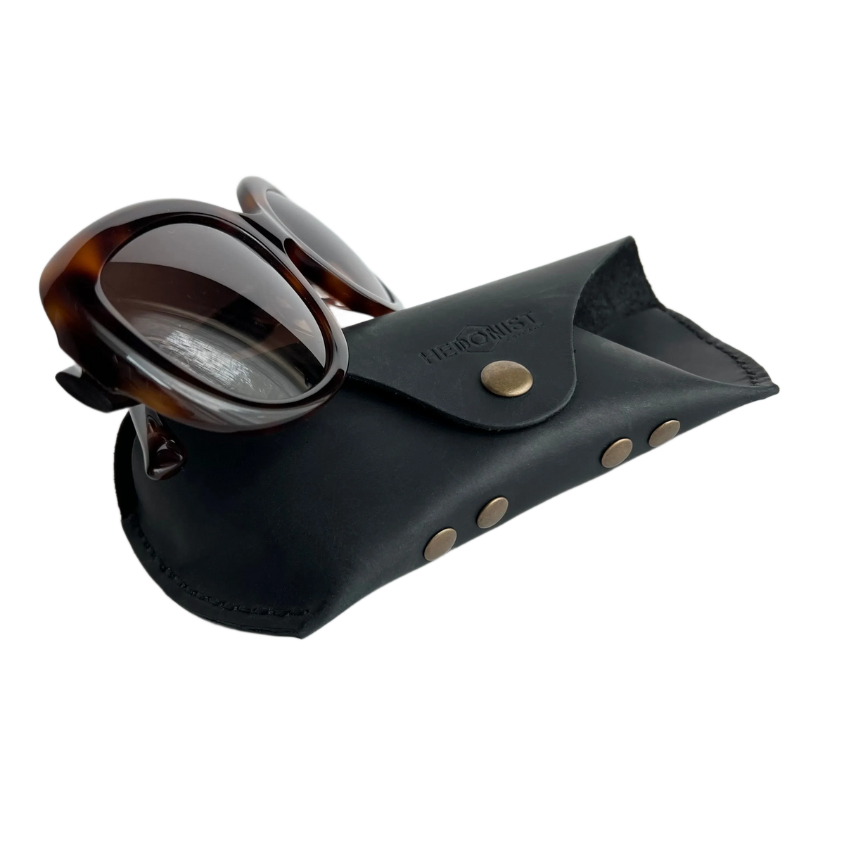 Soft Leather Eye Glasses Case in Black with tortoiseshell sunglasses leaning against it