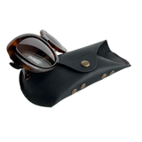 Soft Leather Eye Glasses Case in Black with tortoiseshell sunglasses leaning against it