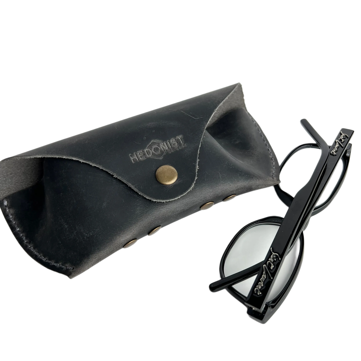 Soft Leather Eye Glasses Case in Black Washed with black cat-eye glasses leaning beside it