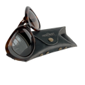 Soft Leather Eye Glasses Case in Black Washed with tortoiseshell sunglasses leaning against it