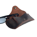 Soft Leather Eye Glasses Case in Brown, open, with black-framed eyeglasses beside it
