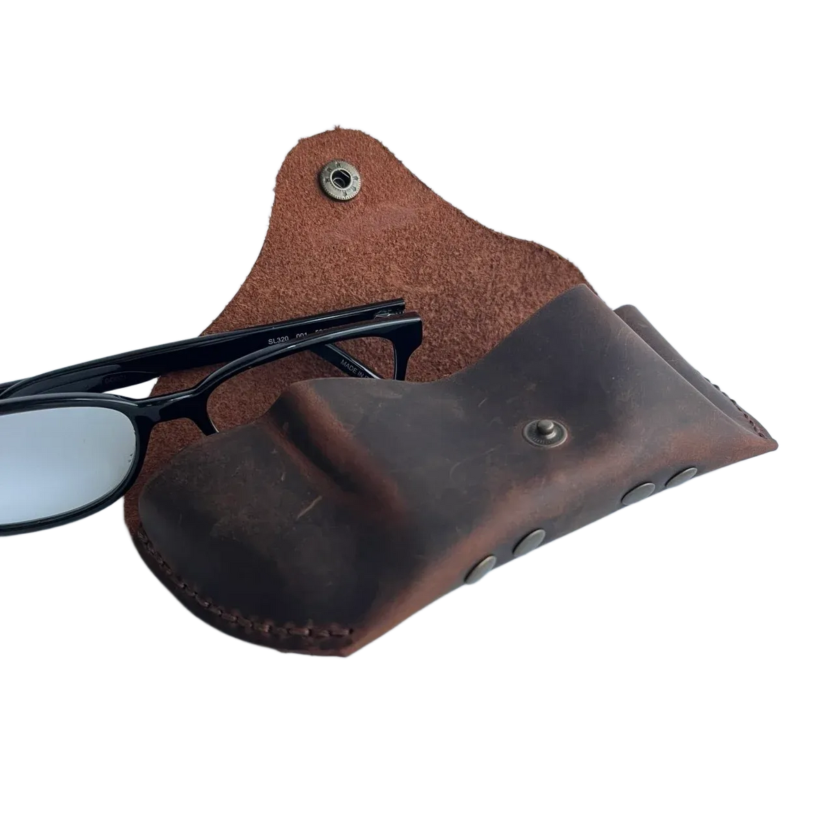Soft Leather Eye Glasses Case in Brown, open, with black-framed eyeglasses beside it