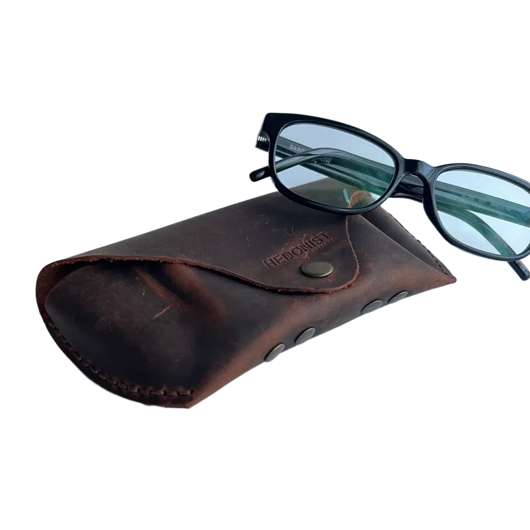 Soft Leather Eye Glasses Case in Brown with tinted-lens eyeglasses resting on top