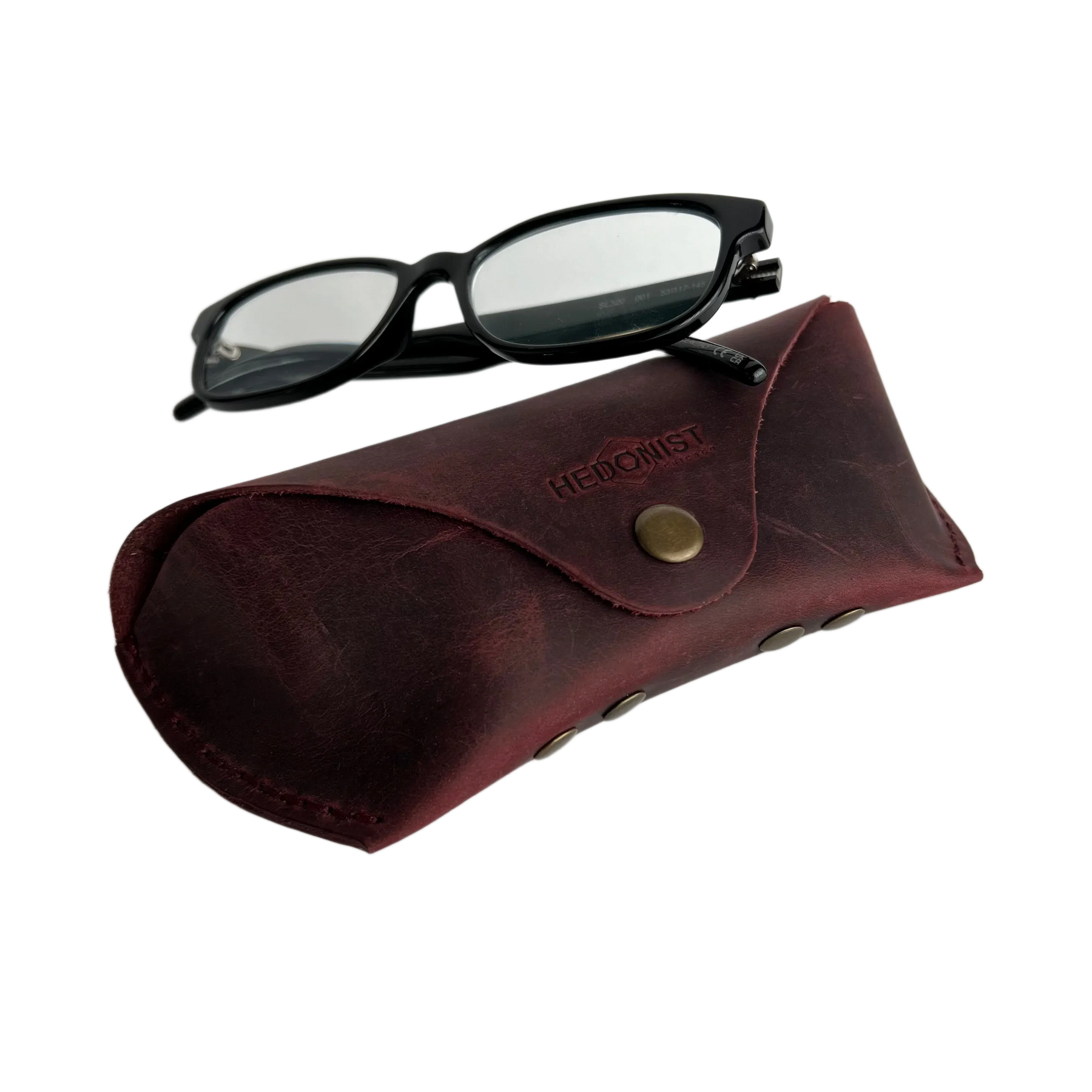 Soft Leather Eye Glasses Case in Burgundy with black-framed eyeglasses resting on top