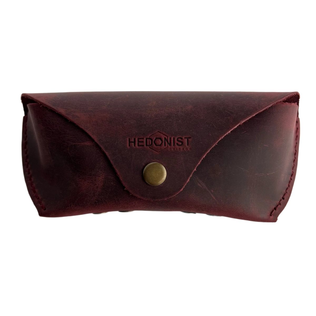 Soft Leather Eye Glasses Case in Burgundy, closed, front view with embossed Hedonist logo and snap closure