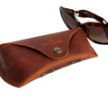 Soft Leather Eye Glasses Case in Cognac with tortoiseshell sunglasses beside it