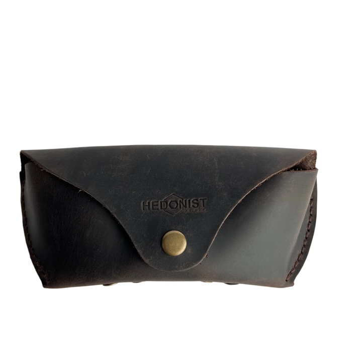 Soft Leather Eye Glasses Case in Dark Brown, closed, front view with embossed Hedonist logo and snap closure