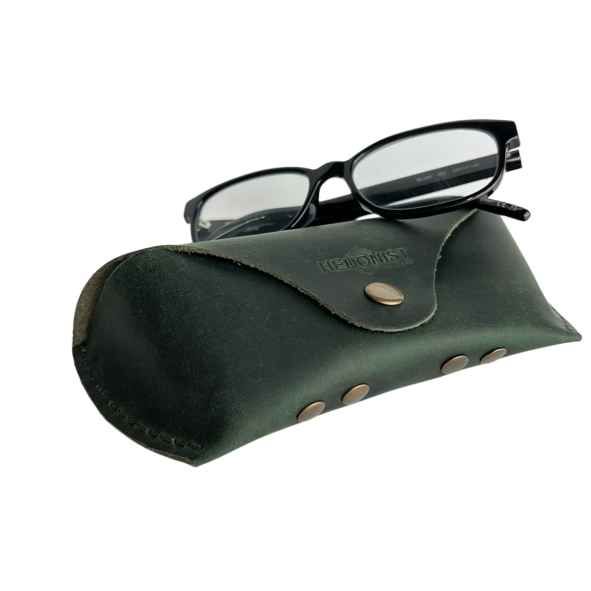 Soft Leather Eye Glasses Case in Dark Green with black-framed eyeglasses resting on top