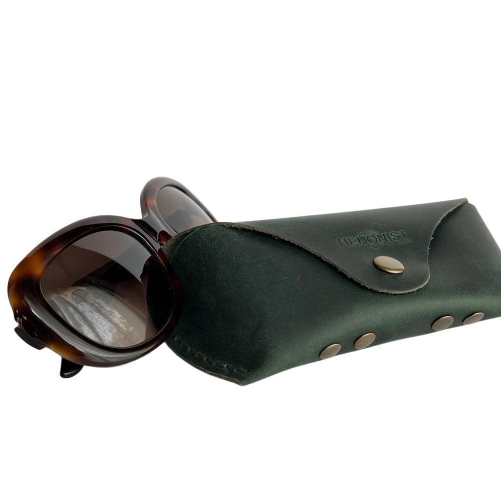 Soft Leather Eye Glasses Case in Dark Green with tortoiseshell sunglasses beside it