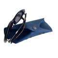 Soft Leather Eye Glasses Case in Navy Blue with tortoiseshell sunglasses resting on top