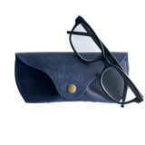Soft Leather Eye Glasses Case in Navy Blue with black-framed eyeglasses resting on top