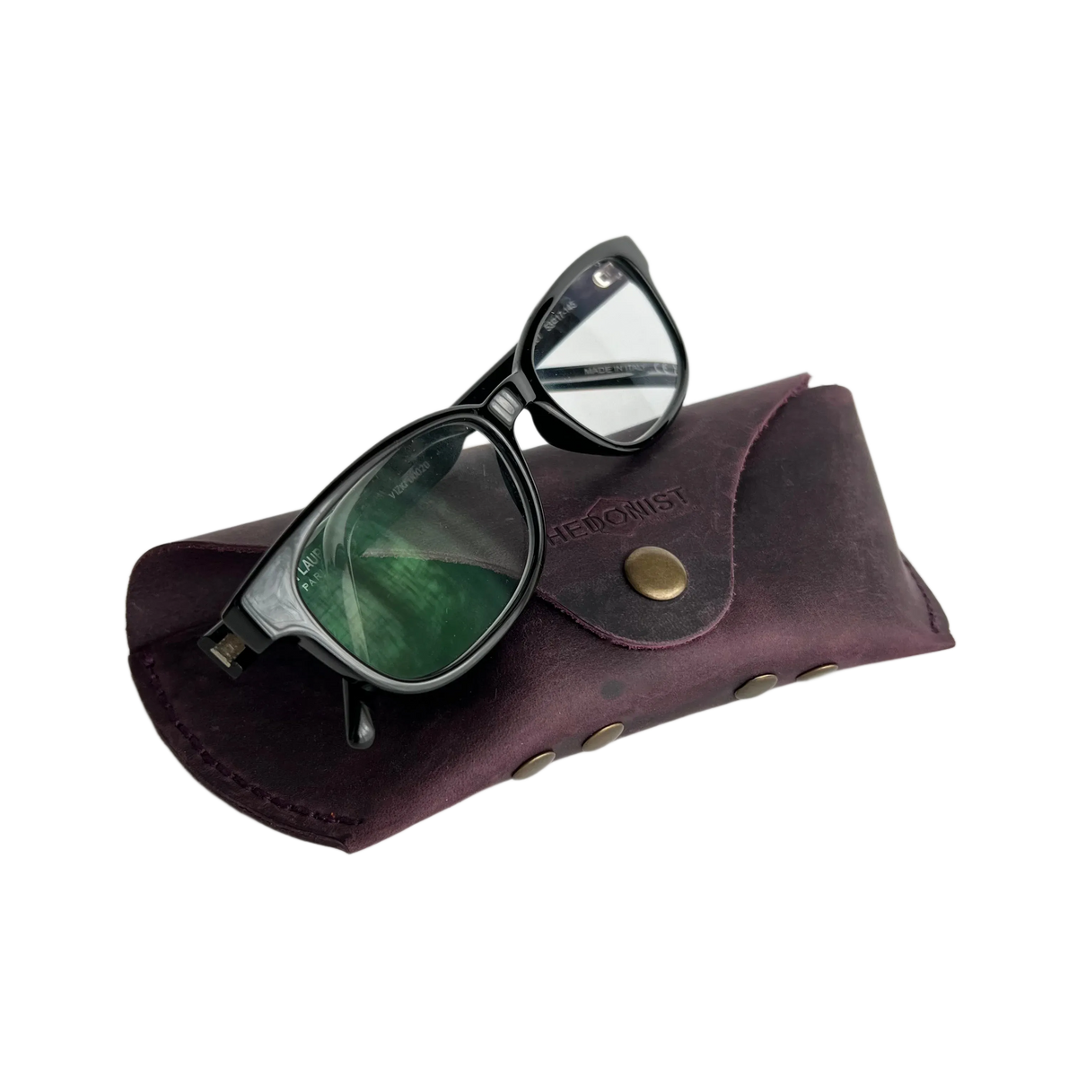 Soft Leather Eye Glasses Case in Plum with tinted-lens eyeglasses resting on top