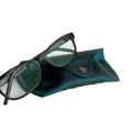 Soft Leather Eye Glasses Case in Teal with black-framed eyeglasses resting on top