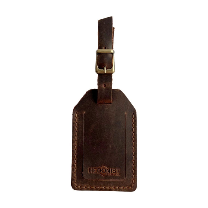 Handmade Leather Luggage Tag in Brown - closed front view with logo