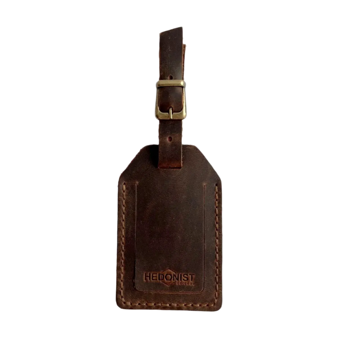 Handmade Leather Luggage Tag in Brown - closed front view with logo