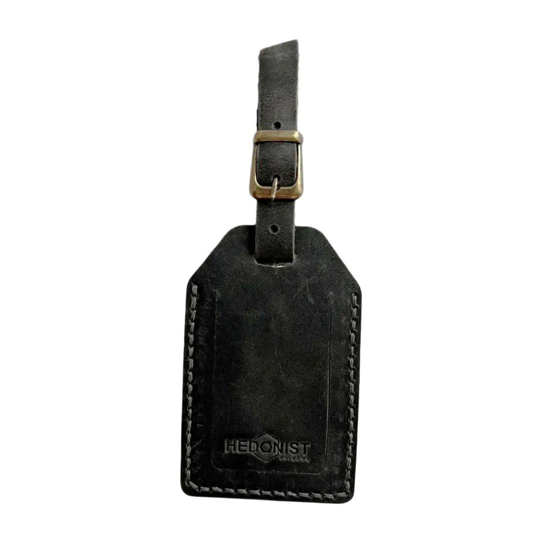 Handmade Leather Luggage Tag in Black Washed - closed front view with logo