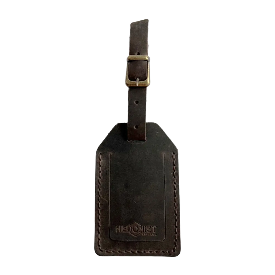 Handmade Leather Luggage Tag in Dark Brown - closed front view with logo