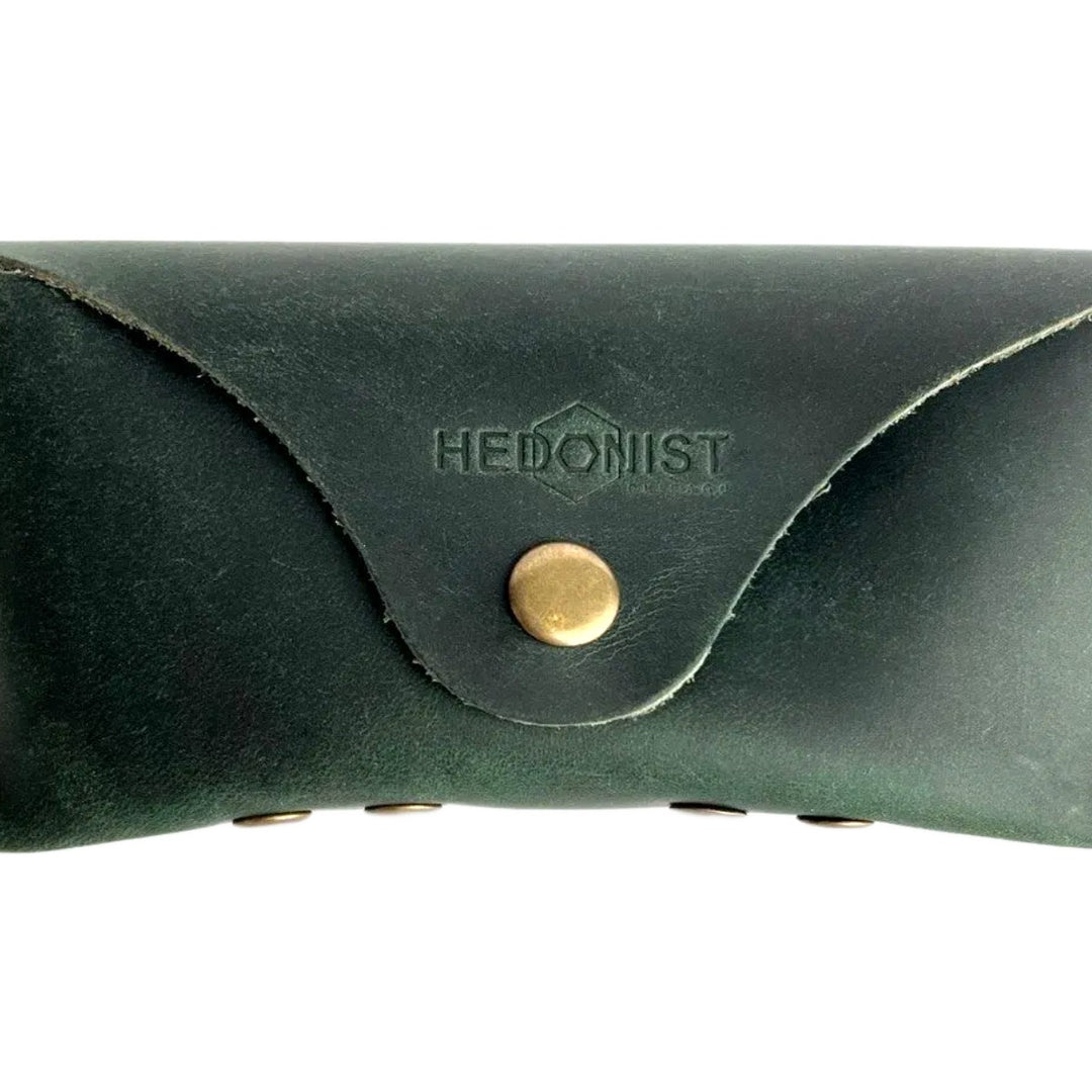 Soft Leather Eye Glasses Case in Dark Green, closed, front view with embossed Hedonist logo and snap closure