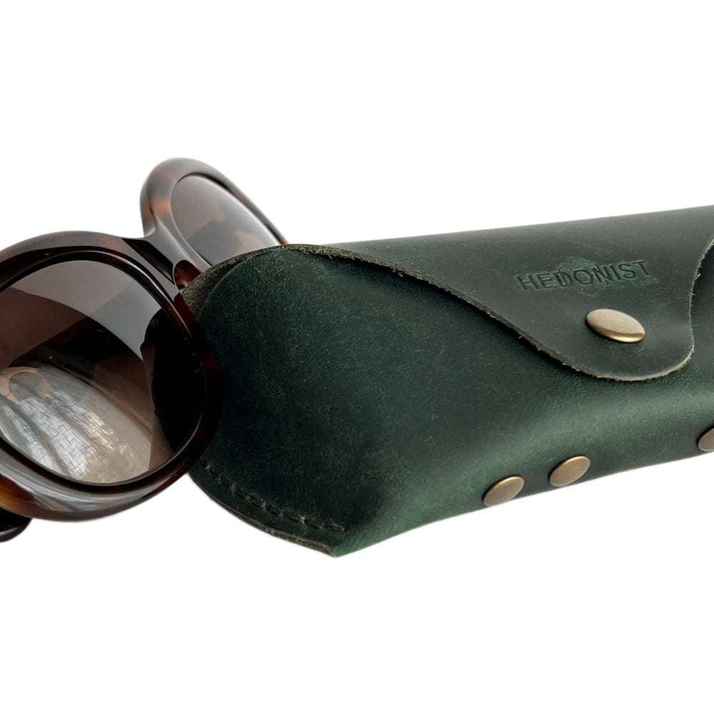 Soft Leather Eye Glasses Case in Dark Green with tortoiseshell sunglasses beside it