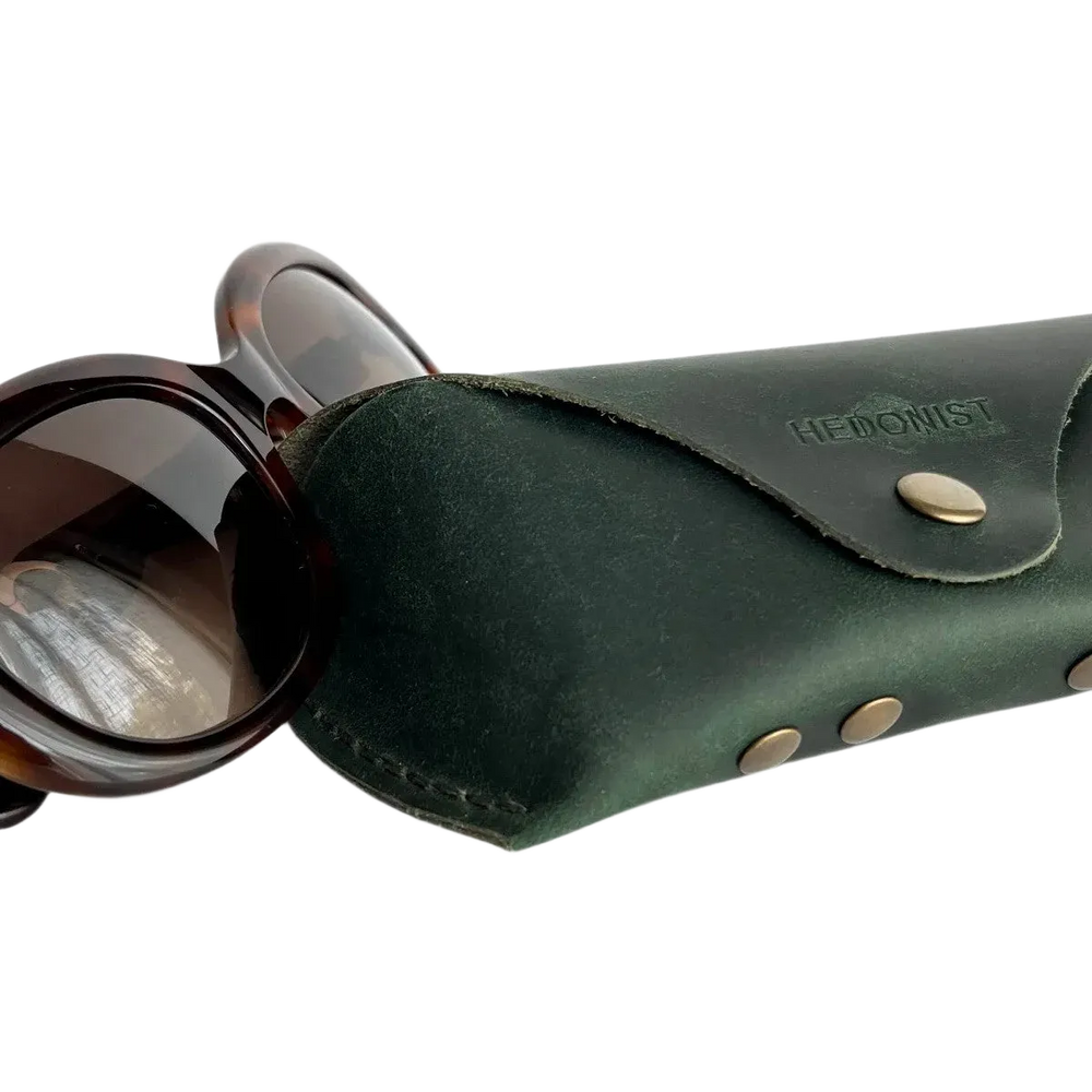 Soft Leather Eye Glasses Case in Dark Green with tortoiseshell sunglasses beside it
