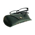 Soft Leather Eye Glasses Case in Dark Green with black-framed eyeglasses resting on top