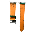 Green leather Apple Watch band, texture and buckle detail close-up