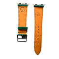 Green leather Apple Watch band, texture and buckle detail close-up