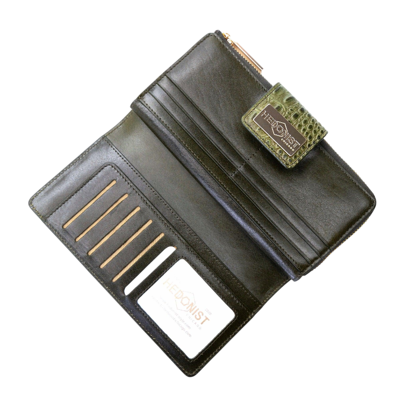 Green croco-embossed leather travel wallet open showing ID window and 19 card slots