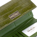 Close-up of green croco-embossed leather trifold wallet showing gold-tone brand plaque and ID window