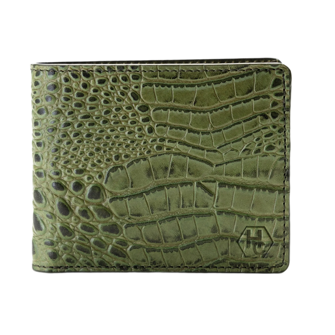 Green bifold wallet with a crocodile-embossed texture and a small debossed logo on the bottom right, shown against a plain white background.