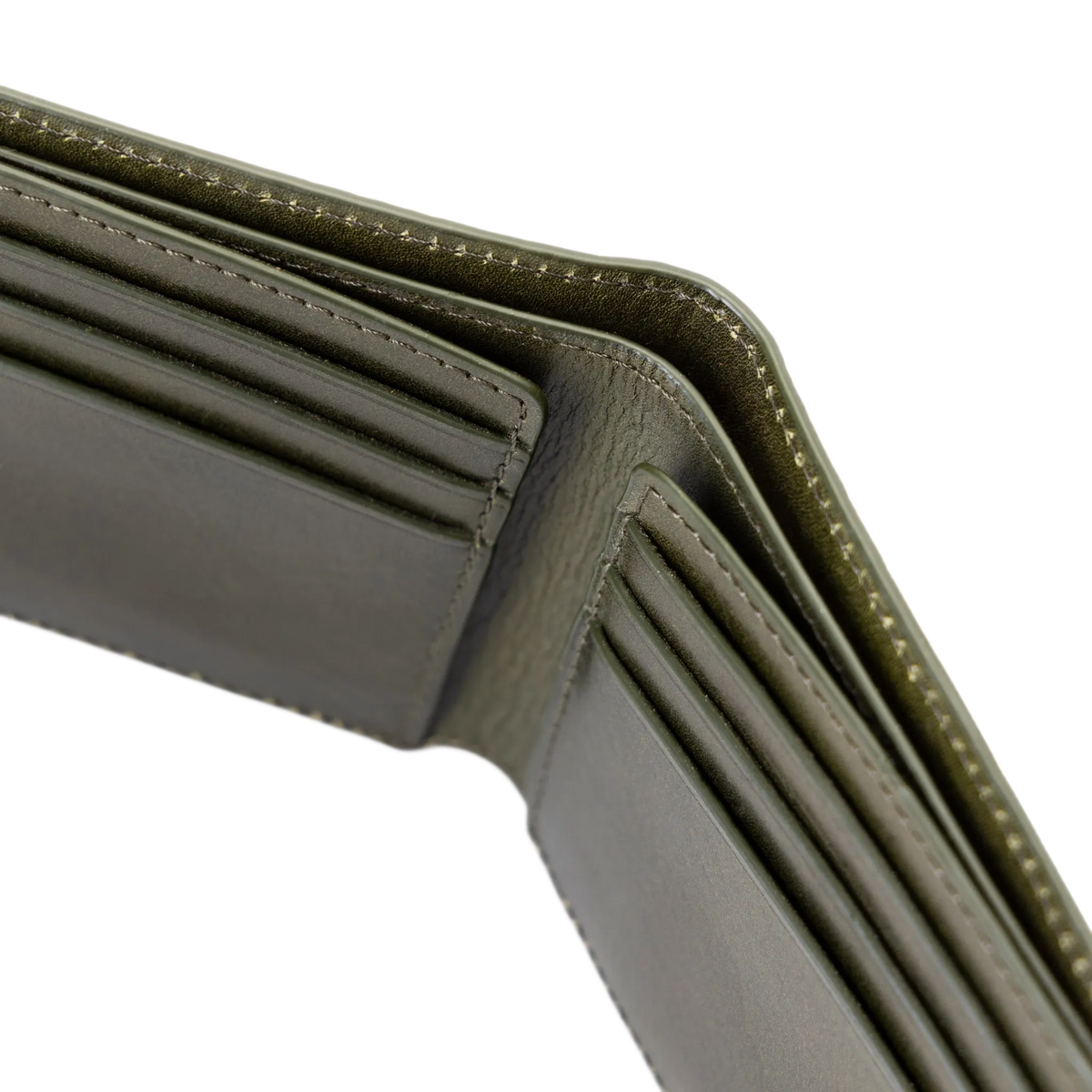 Close-up of green bifold wallet opened to show the interior card slots, stitching, and leather texture against a white background.