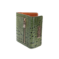 Small green croco-embossed snap wallet for women, close-up of embossed texture