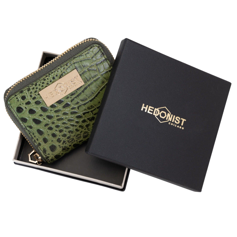 Small green croco-embossed zip wallet for women, presented as a gift