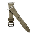 Grey leather Apple Watch band, texture and buckle detail close-up