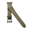 Grey leather Apple Watch band, texture and buckle detail close-up