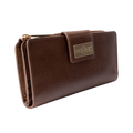 Brown leather travel wallet closed, front view with gold-tone Hedonist Chicago plaque