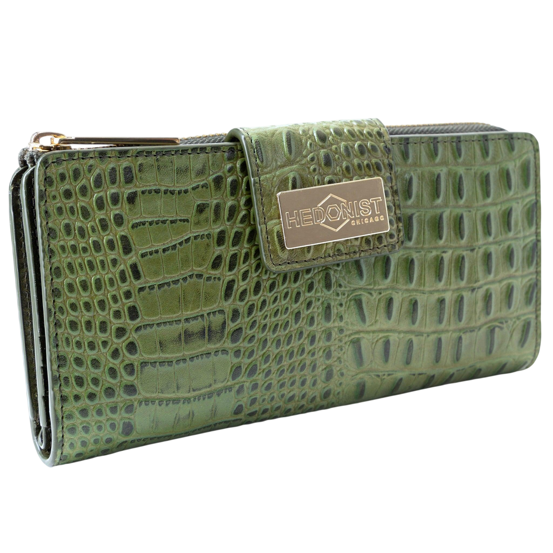 Front view of women’s green croc-embossed leather long travel wallet with secure zip-around closure