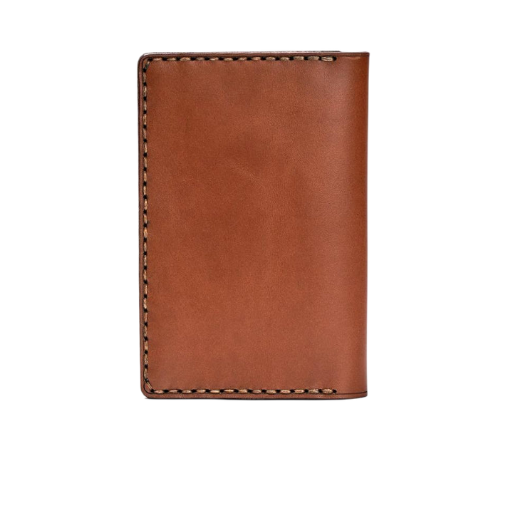 Hedonist Chicago light mahogany passport case in light mahogany, travel cover, full grain leather, angled view