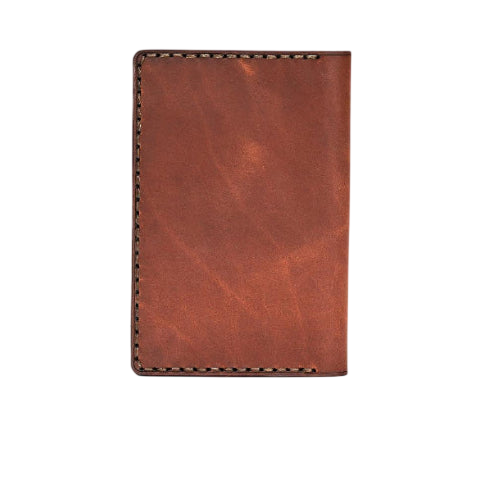 Hedonist Chicago light mahogany passport case in light mahogany, travel cover, full grain leather, angled view