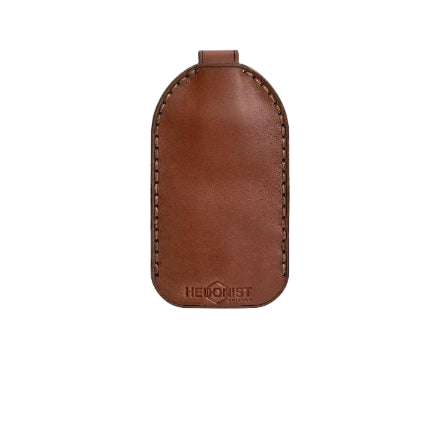 Hedonist Chicago whisky key chain in whisky, slim profile, full grain leather, angled view