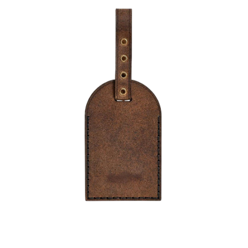 Hedonist Chicago whisky luggage tag in whisky, with strap, full grain leather, angled view