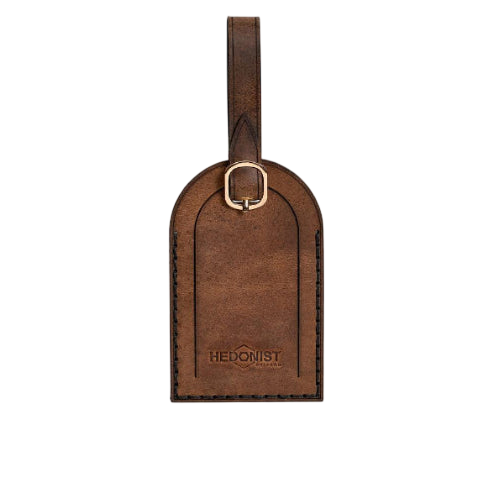 Hedonist Chicago whisky luggage tag in whisky, with strap, full grain leather, product view
