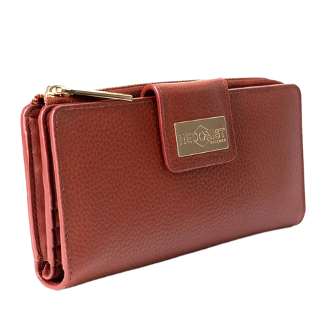 Large red pebbled leather travel wallet front view on white background