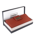 Large red pebbled leather travel wallet presented in Hedonist Chicago branded gift box