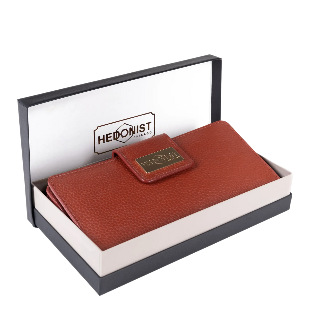 Large red pebbled leather travel wallet presented in Hedonist Chicago branded gift box