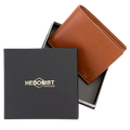 Light brown leather bifold wallet displayed with Hedonist Chicago branded packaging