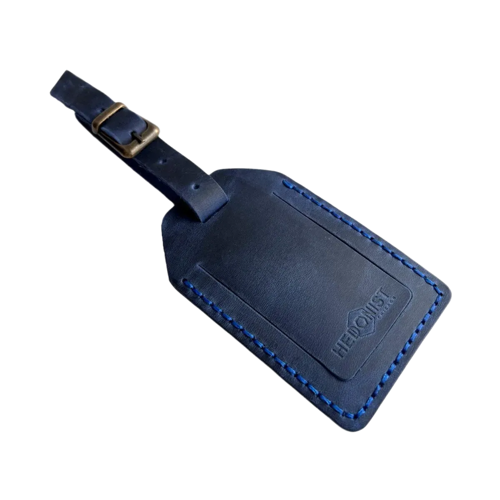 Handmade Leather Luggage Tag in Navy Blue - closed front view with logo