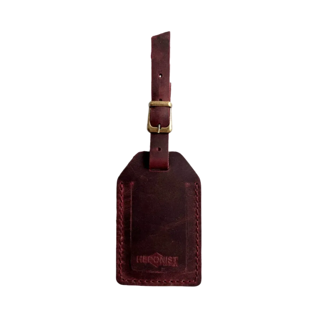 Handmade Leather Luggage Tag in Burgundy - closed front view with logo