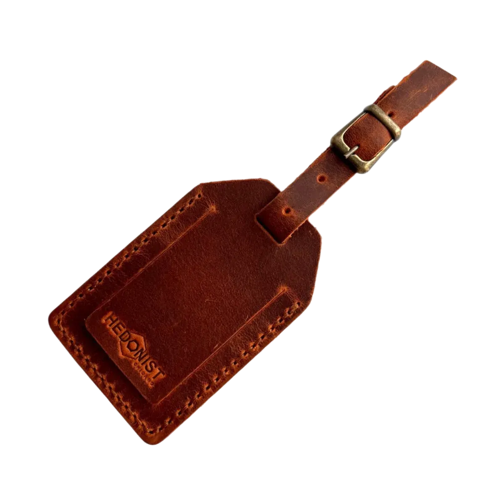 Handmade Leather Luggage Tag in Cognac - closed front view with logo